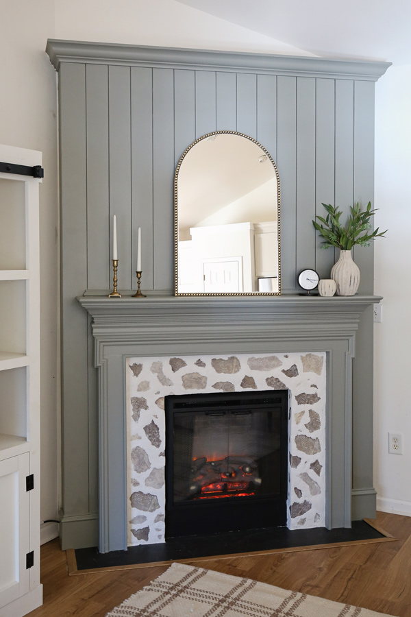 DIY shiplap fireplace with a faux stone fireplace DIY surround