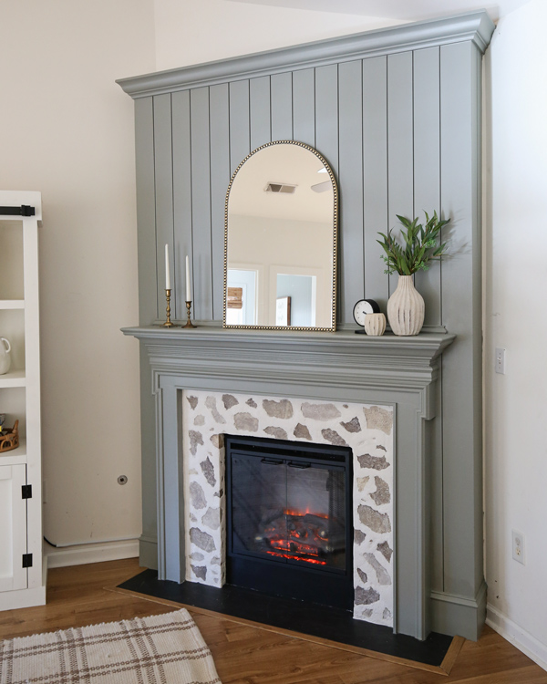 DIY shiplap fireplace with a faux stone fireplace DIY surround