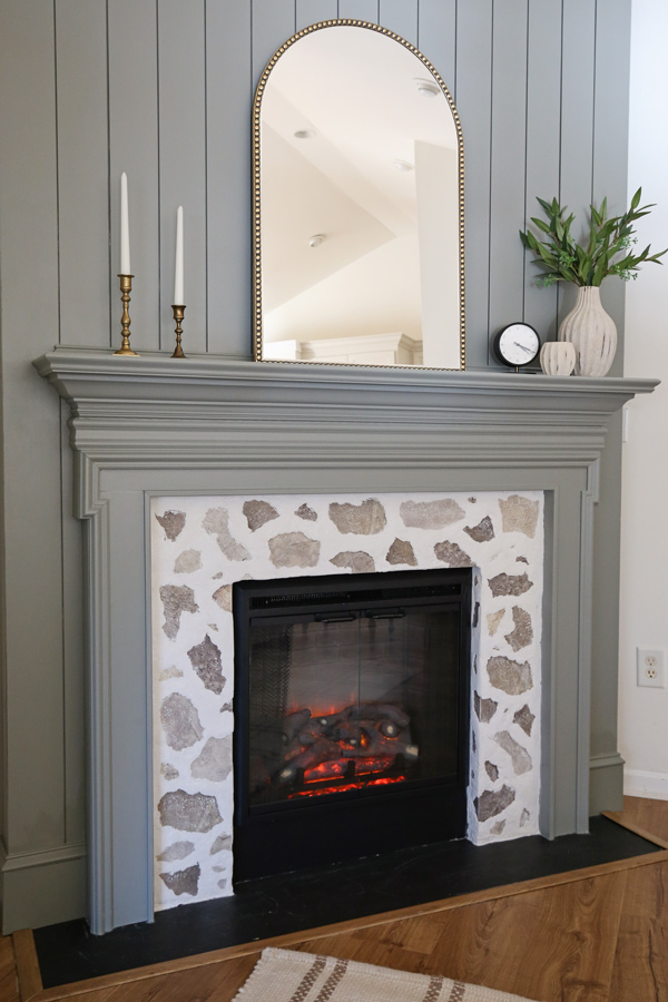 DIY shiplap fireplace with a faux stone fireplace DIY surround