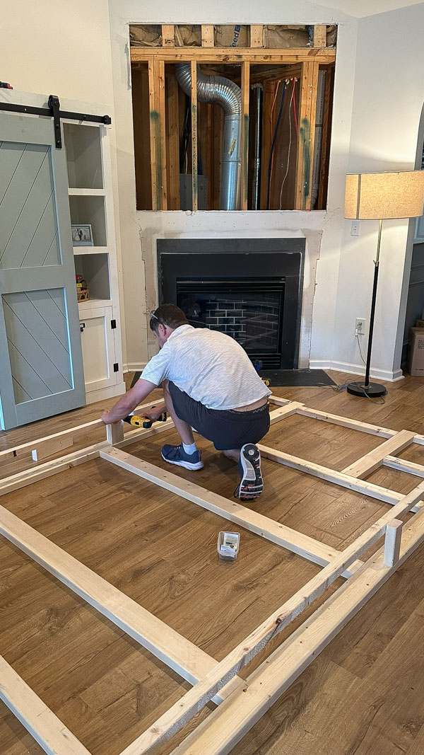 building frame for DIY shiplap fireplace wall