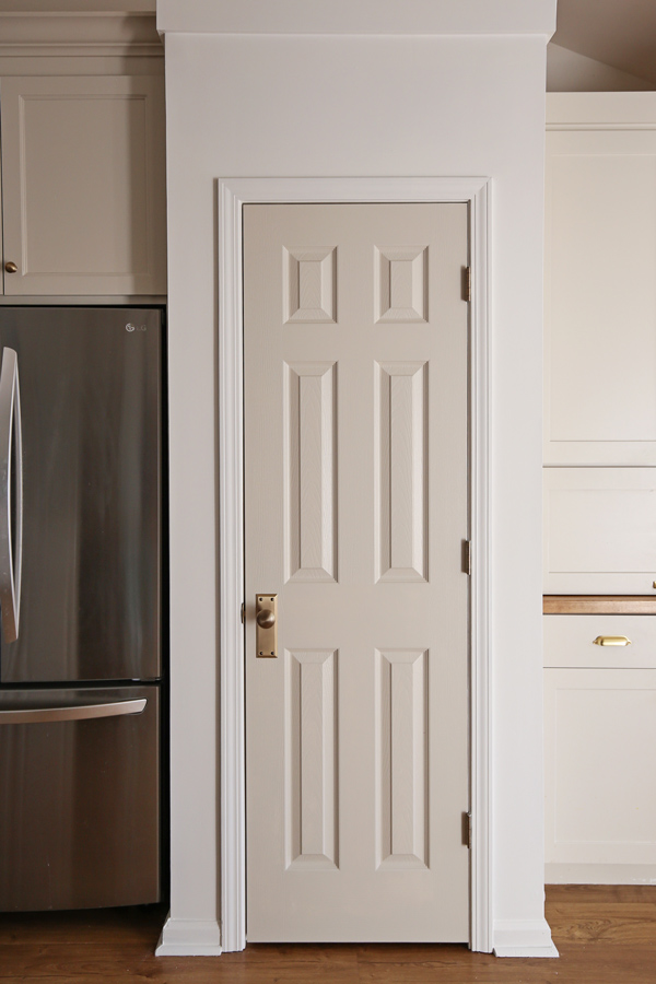 vintage antique brass door knob on gray painted pantry door in kitchen painted edgecomb gray by benjamin moore