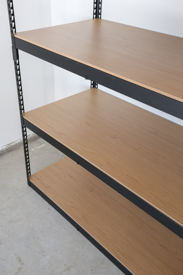 garage storage shelves ideas with black frame and wood shelves