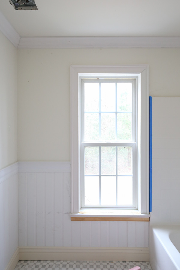 installing window casing, chair rail, beadboard wainscoting, baseboard, and crown molding in bathroom