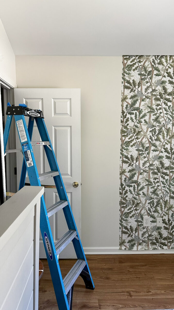 installing woodland tree peel and stick full wall wallpaper on boy bedroom wall