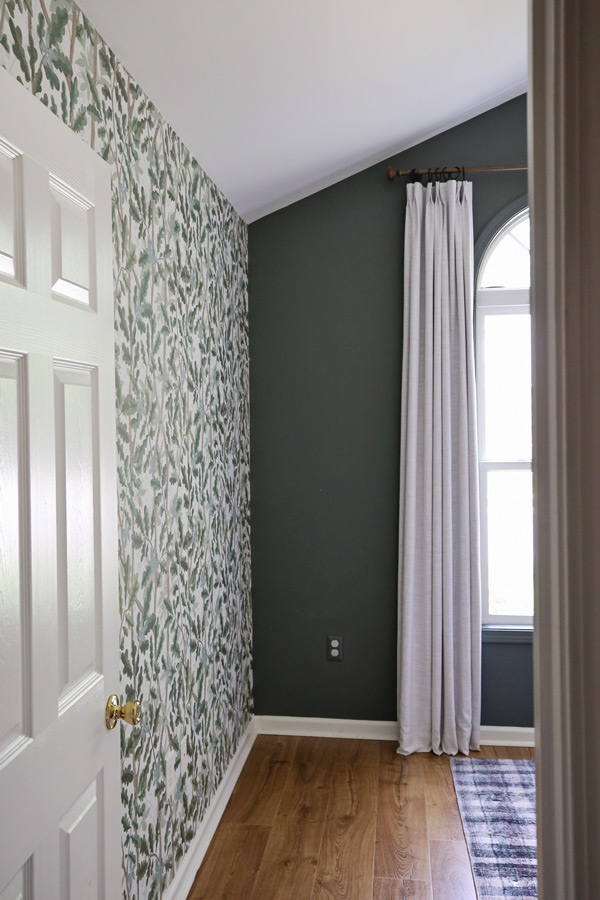 woodland tree peel and stick full wall wallpaper on boy bedroom wall and green accent wall. Boy bedroom decor ideas.