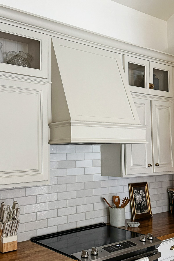 custom DIY range hood cover with molding in kitchen makeover