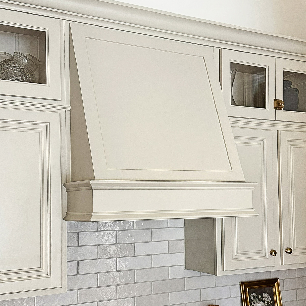custom DIY range hood cover with molding in kitchen makeover