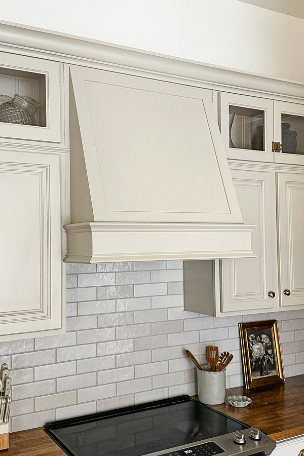 custom DIY range hood cover with molding in kitchen makeover