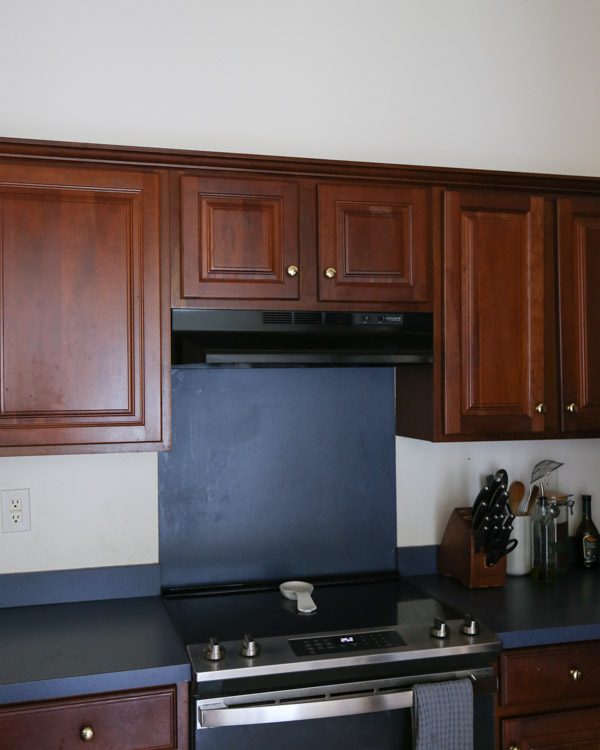 outdated kitchen before with old range hood