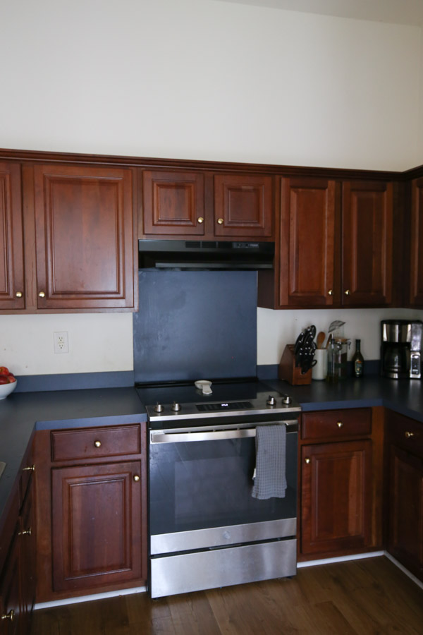 outdated kitchen before with old range hood