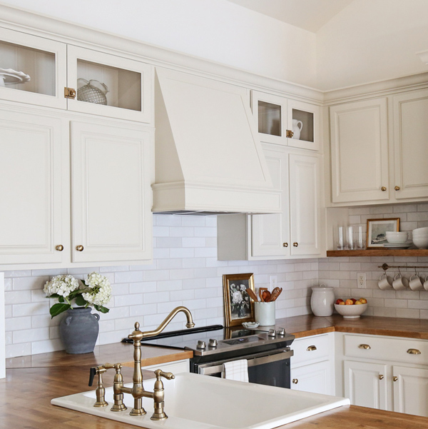 custom DIY range hood cover with molding in kitchen makeover