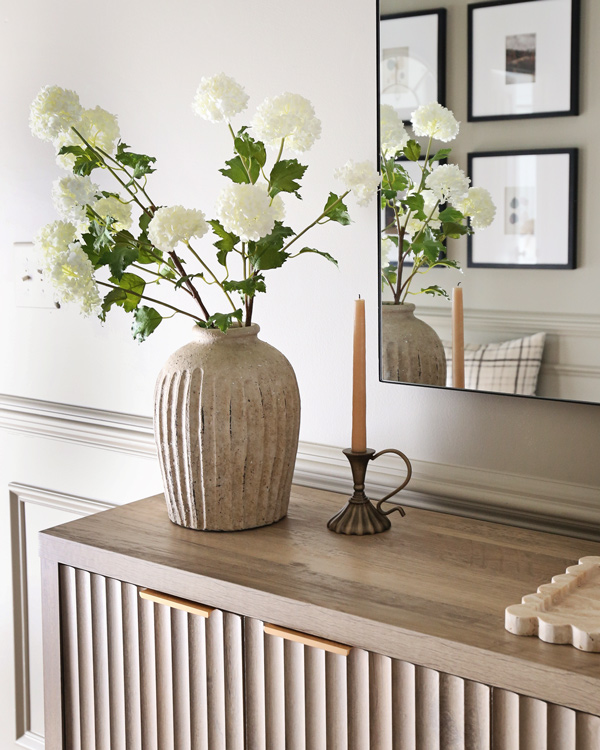 entryway table decor, mirror, and distressed vase