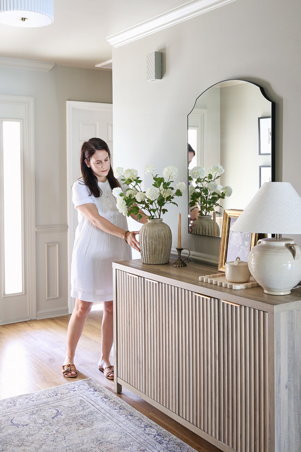 styling entryway decor and adding faux florals to entryway table