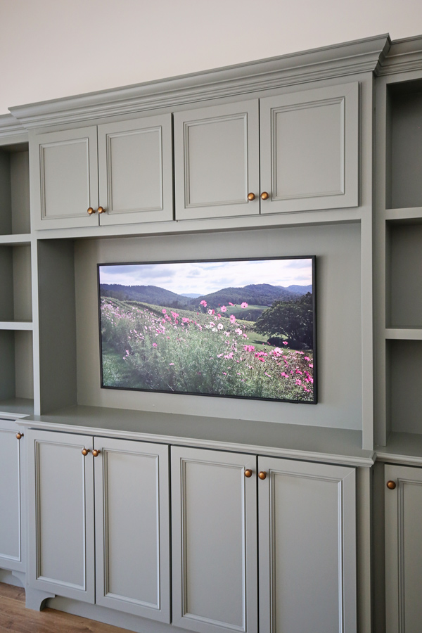 Frame TV on diy built in entertainment center and diy built in cabinets living room