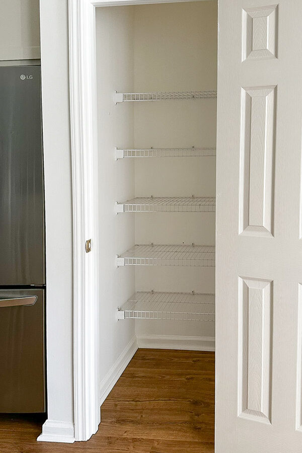 wire shelves before wood shelf covers