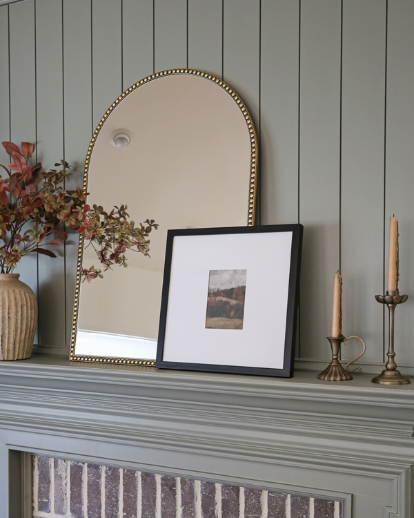 fall stems on fireplace mantel in distressed vase and beaded arch mirror and square picture frame fall art