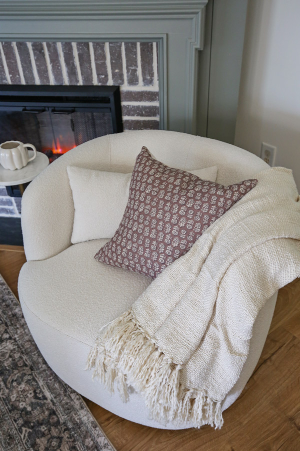 cozy fall fireplace decor and fall fireplace sitting area with swivel chair,