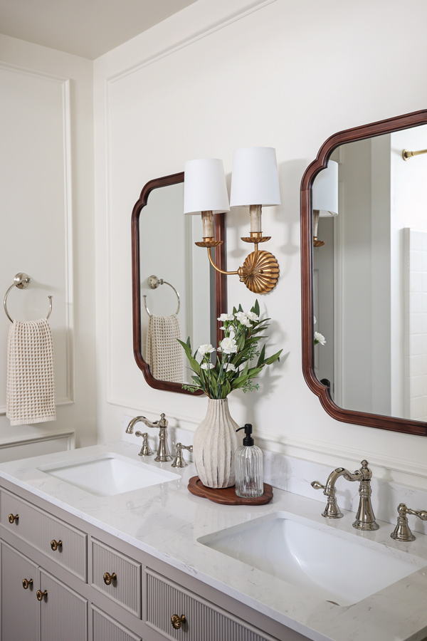primary bathroom makeover with flush mount ceiling light and regina andrew clove wall sconce