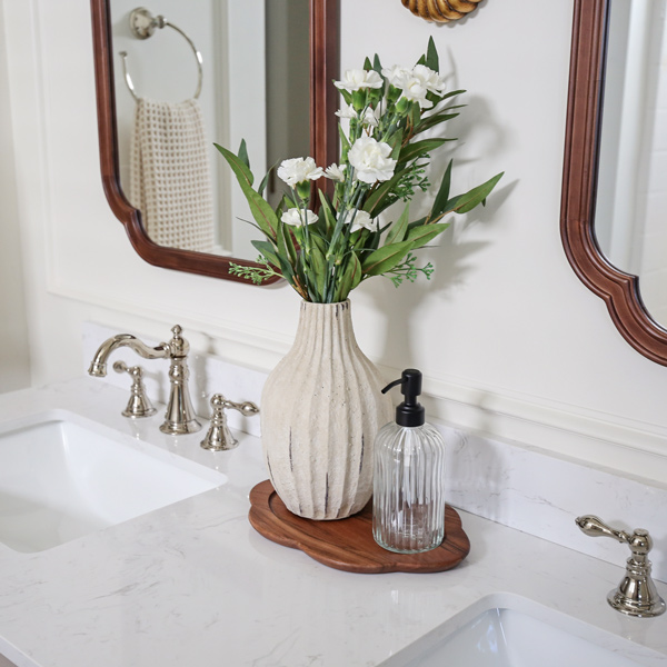 timeless, charming, classic, vintage look bathroom makeover with double wall sconce, and wood arch mirrors and polished nickel faucet