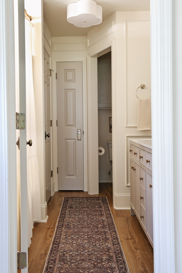 greige doors and white walls in bathroom makeover