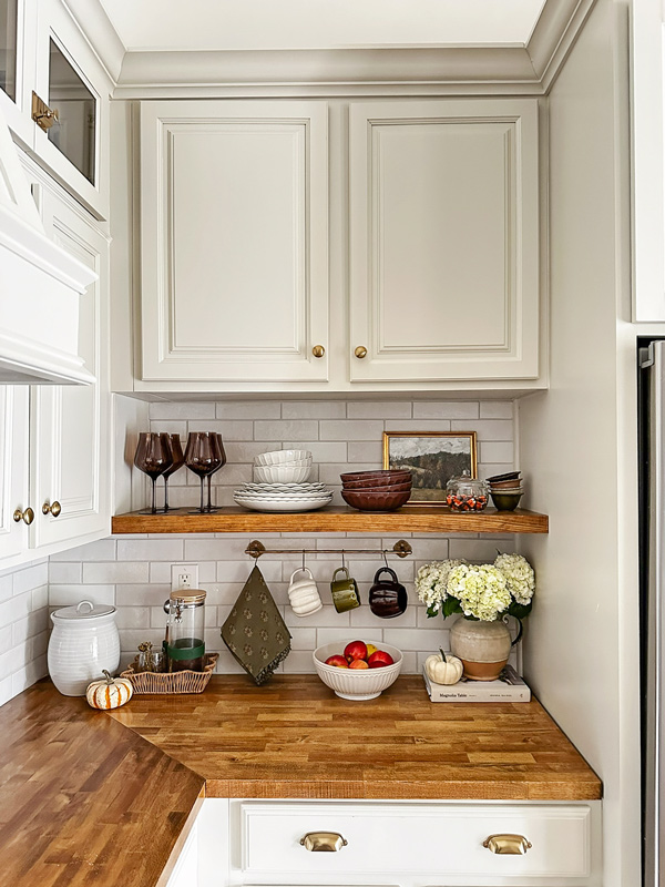 kitchen fall shelf decor and brown dishware