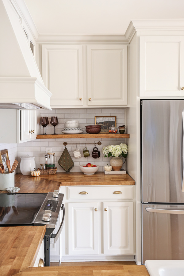 kitchen fall shelf decor and brown dishware