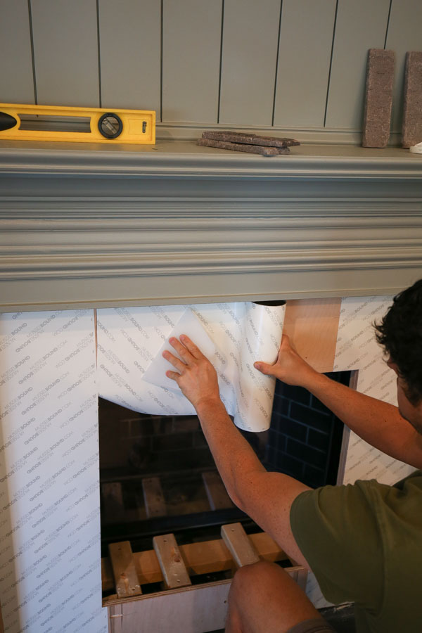 using musselbound adhesive tile mat for DIY brick fireplace