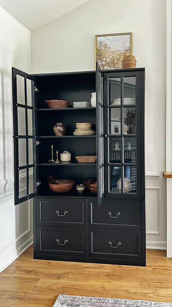 amazon storage cabinet with glass doors in corner nook with angled vaulted ceiling