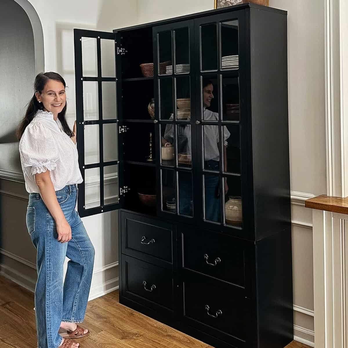 amazon storage cabinet with glass doors in corner nook with angled vaulted ceiling