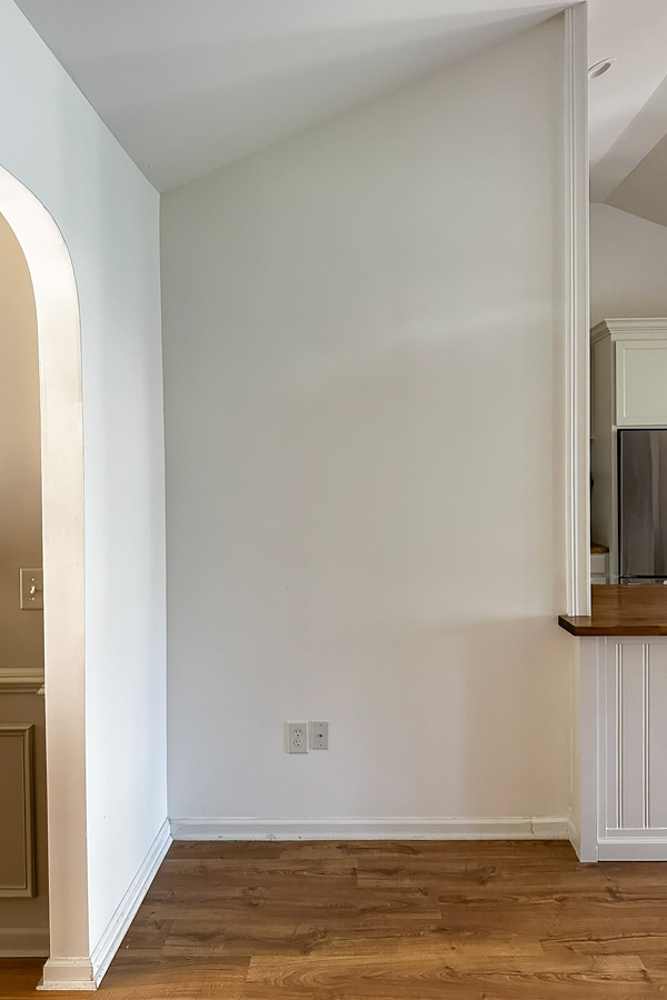 corner nook with angled ceiling before makeover but after casing