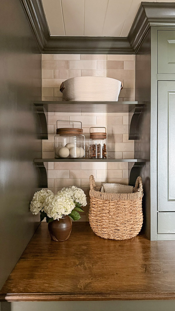 small laundry room makeover before and after with wood shelves on corbels