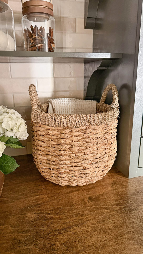 small laundry room makeover before and after with wicker basket on wood countertop