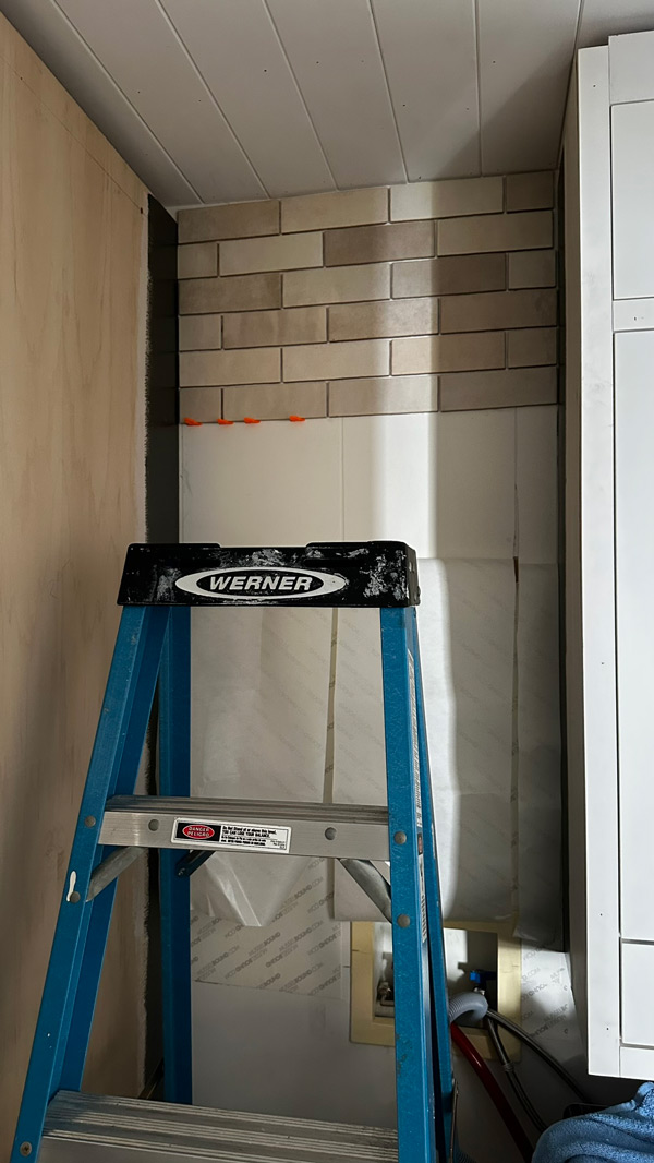 installing tile backsplash in small laundry room