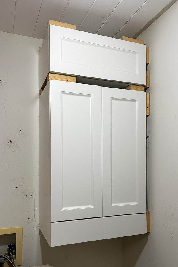 stacked cabinet in laundry room. diy built in wall cabinet