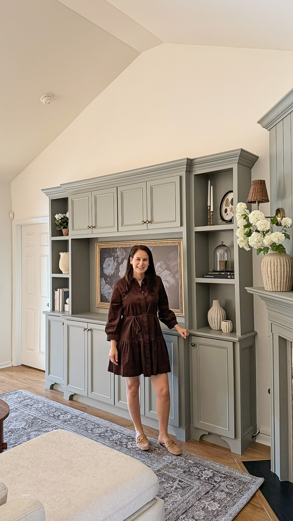 creator standing in charming living room makeover before and after with living room diy built ins and diy shiplap fireplace