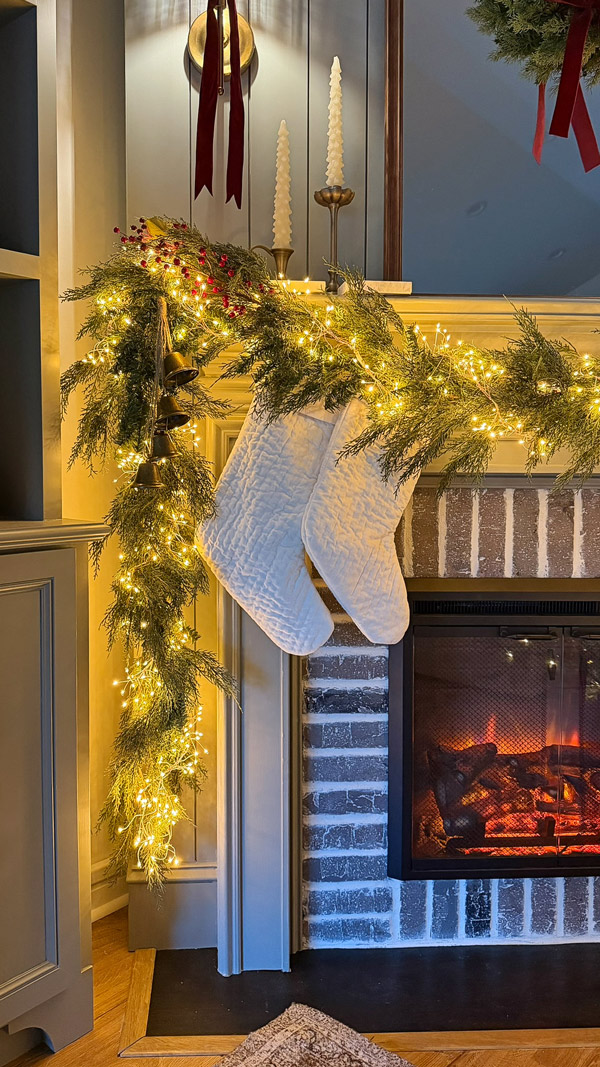 cedar garland on vintage inspired, cozy, classic Christmas mantel and Christmas tree with shiplap fireplace