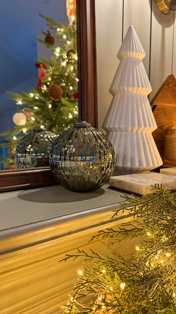 candle ornament on vintage inspired, cozy, classic Christmas mantel and Christmas tree with shiplap fireplace