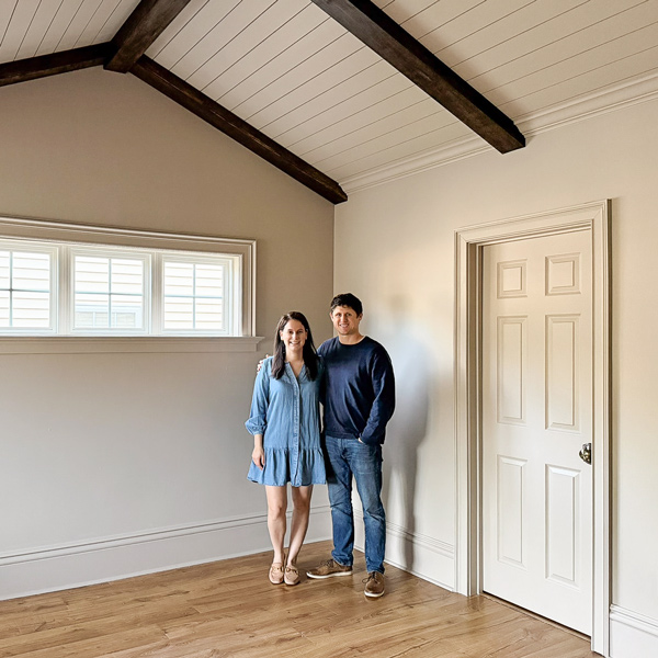 primary bedroom makeover - how we added character to our builder grade bedroom with architectural details, wood beams, vaulted ceiling with shiplap