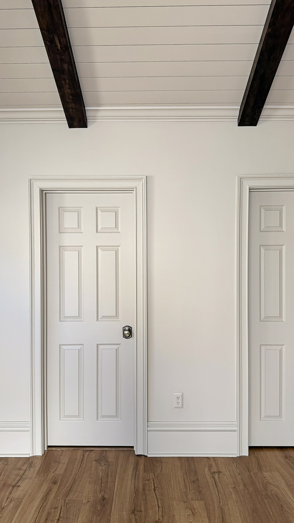 extra tall DIY baseboards and charming door casing