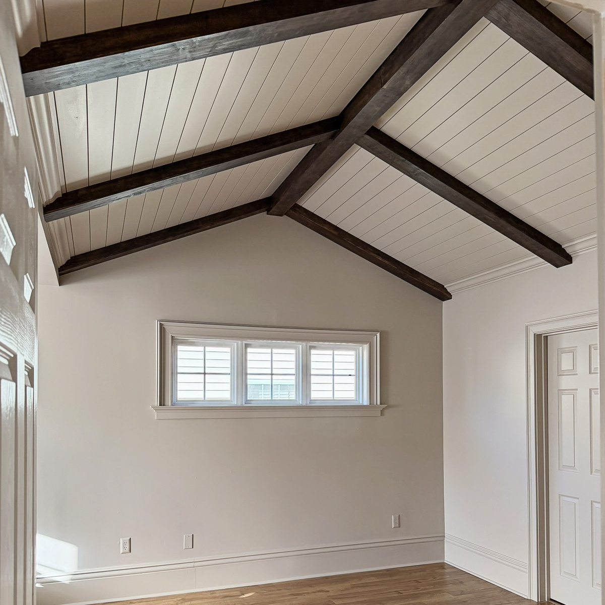 primary bedroom makeover - how we added character to our builder grade bedroom with architectural details, wood beams, vaulted ceiling with shiplap