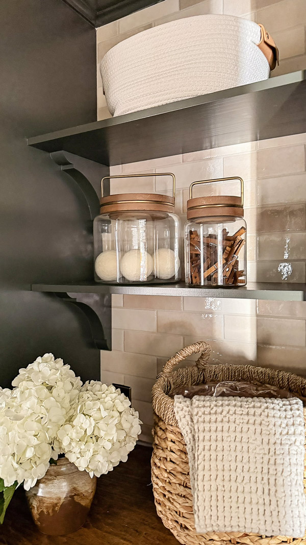 glass jars with wood lids in Laundry Room Organization Ideas with Charm and Function