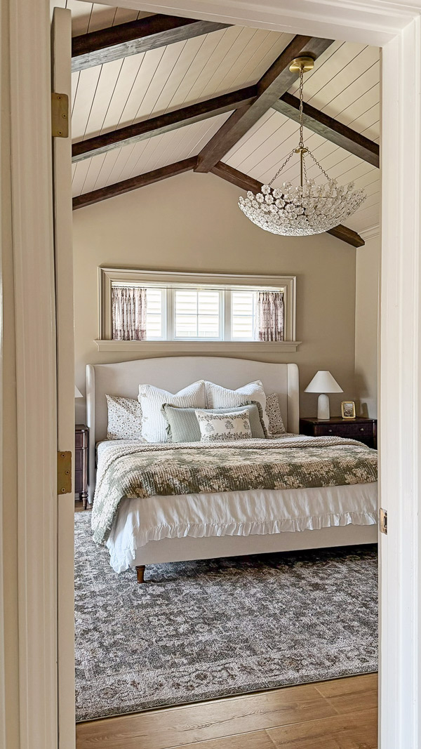 Charming Primary Bedroom Makeover with patterns, florals, wood beams, cozy bedding