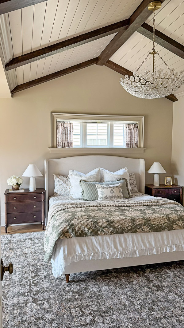 Charming Primary Bedroom Makeover with patterns, florals, wood beams, cozy bedding