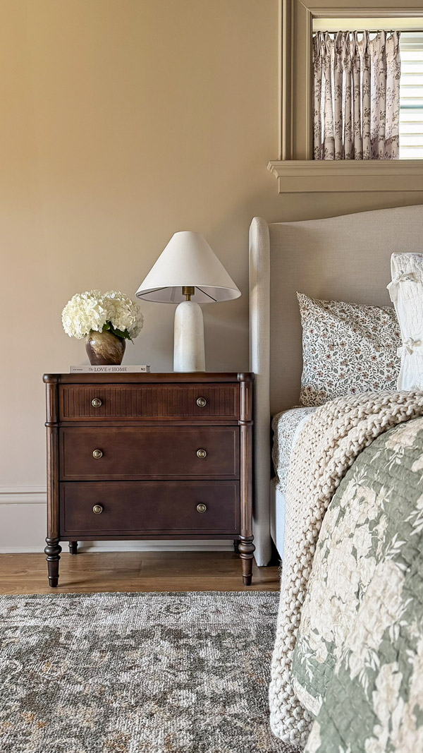 Charming Primary Bedroom Makeover with wood fluted nightstand