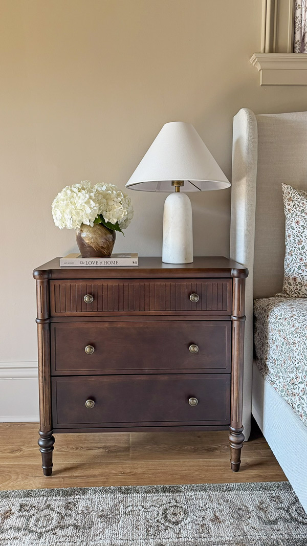 Charming Primary Bedroom Makeover with wood fluted nightstand