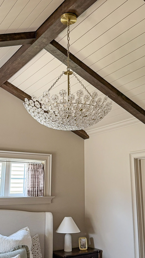 lighting upgrades to transform our home - Charming Primary Bedroom Makeover with dreamy chandelier and vaulted planked ceiling and wood beams
