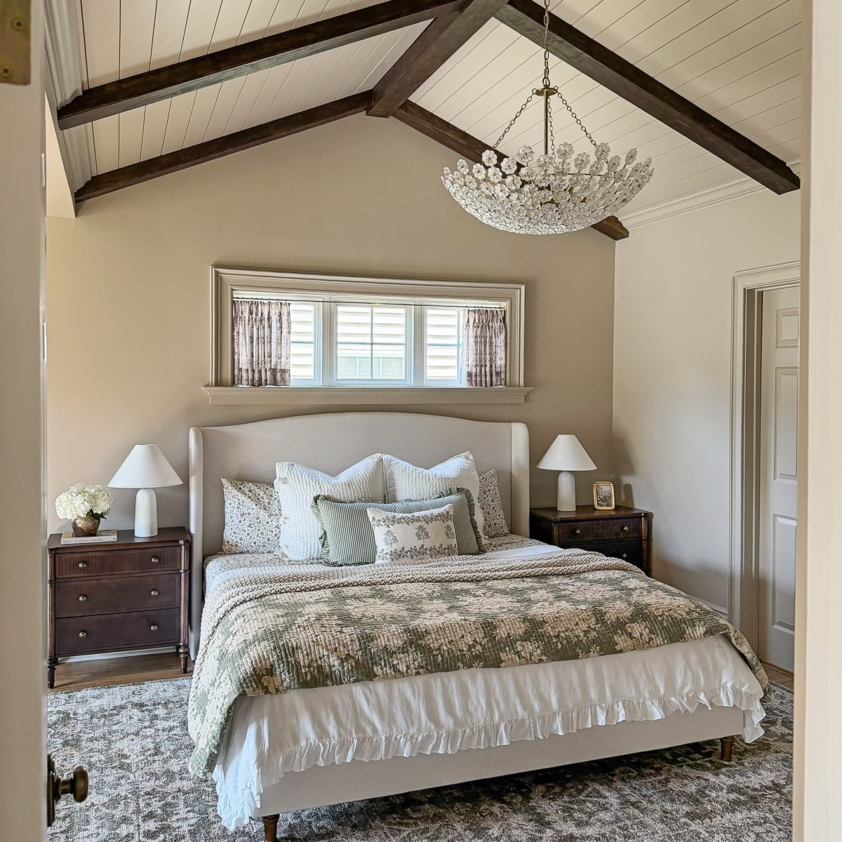 Charming Primary Bedroom Makeover with patterns, florals, wood beams, cozy bedding