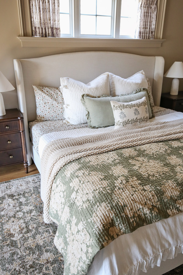 Charming Primary Bedroom Makeover with patterns, florals, wood beams, cozy bedding