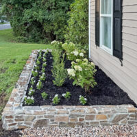 How to build a DIY stone wall for garden bed.
