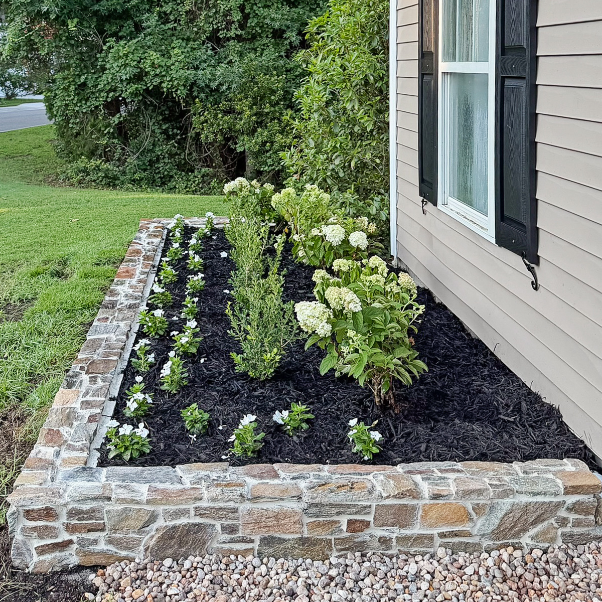 How to build a DIY stone wall for garden bed.